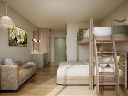 A bright, cozy kids&rsquo; bedroom with a wooden bunk bed, sofas, pendant lamps, a landscape painting, and a small vanity by a door.