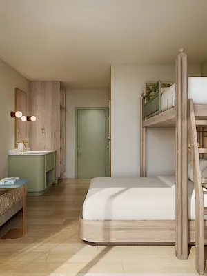 A bright kids’ room with a bunk bed, desk nook, sofa, framed garden photo, and two hanging lamps.